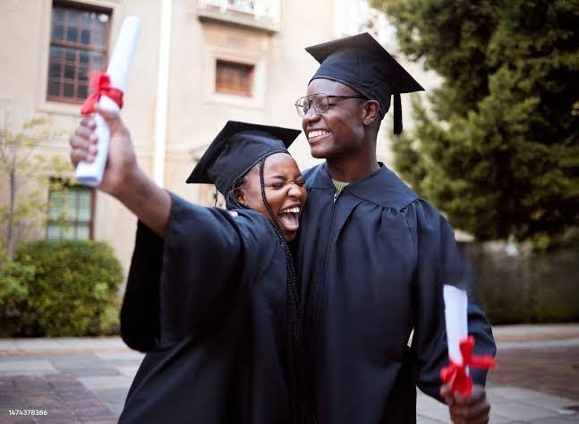 University students in graduation gowns